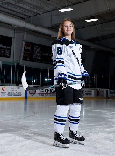 Cara Cook wearing her Aurora University hockey jersey