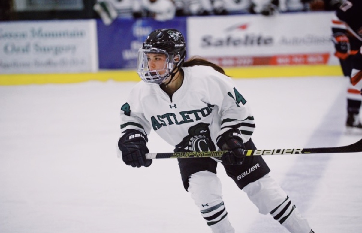 Sara Molina playing collegiate hockey for Castleton