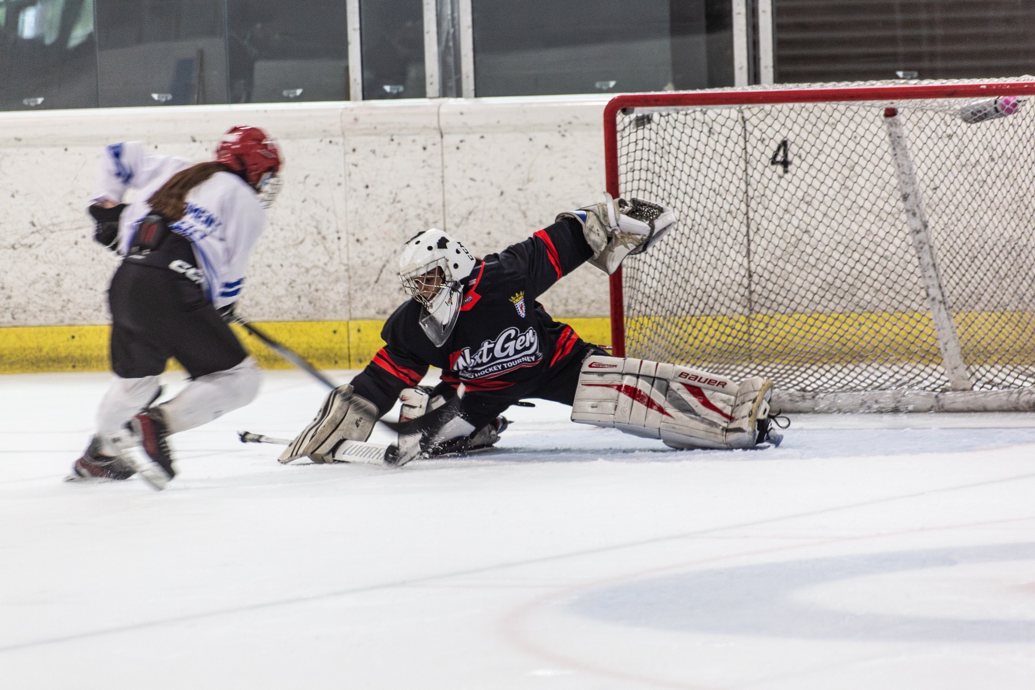 Next Gen goalie making a save as a player approaches the net